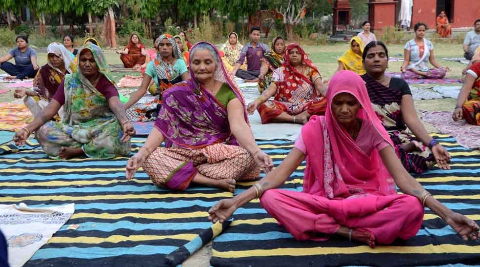 rural areas womens doing yoga with saree