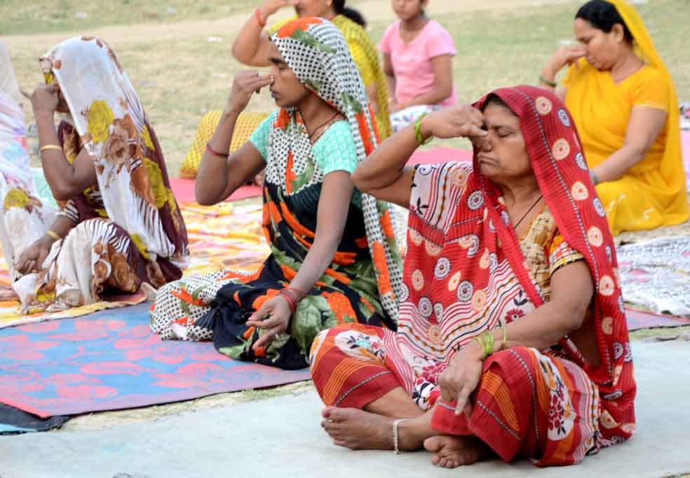 rural areas womens doing yoga with saree