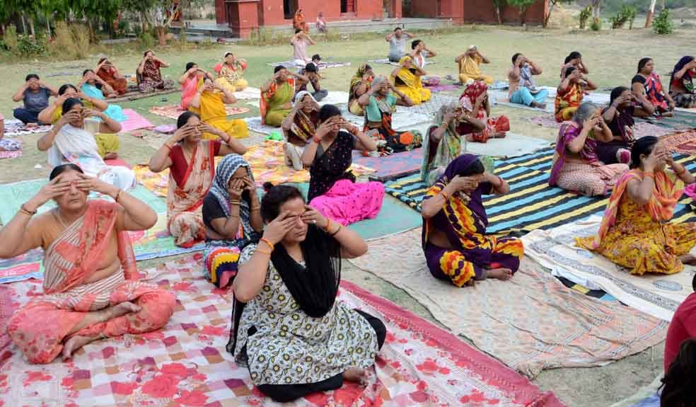 rural areas womens doing yoga with saree