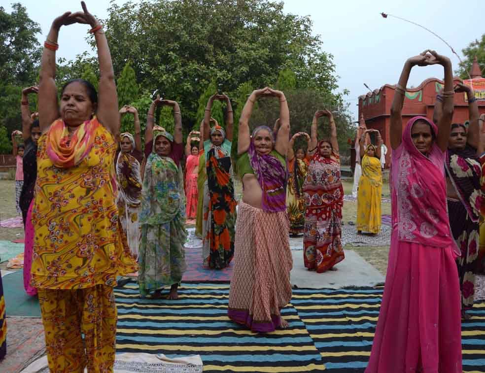 rural areas womens doing yoga with saree