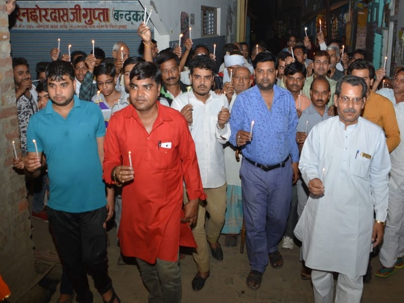 homage to martyrs by candle march in firozabad