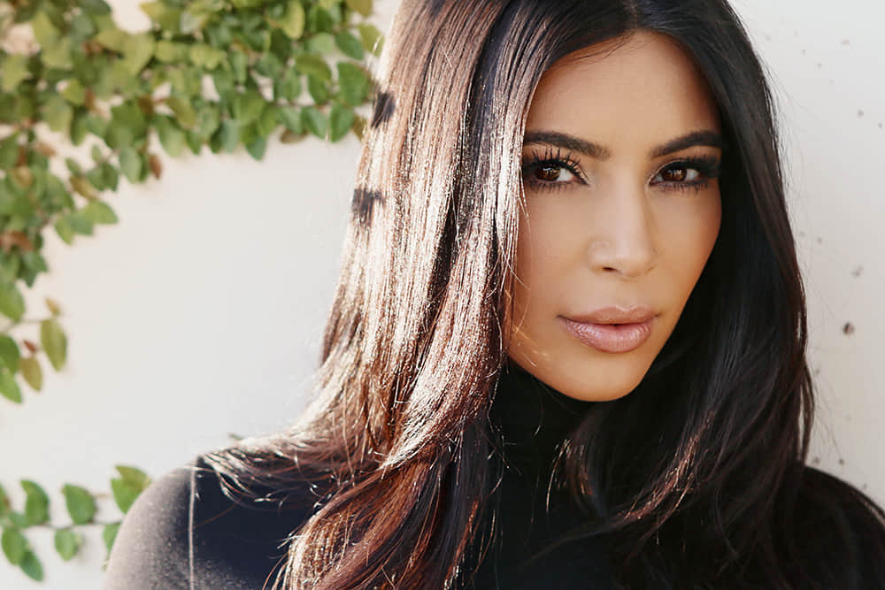 Kim and Kourtney Kardashian parade their beach bods in matching silver bikinis 
