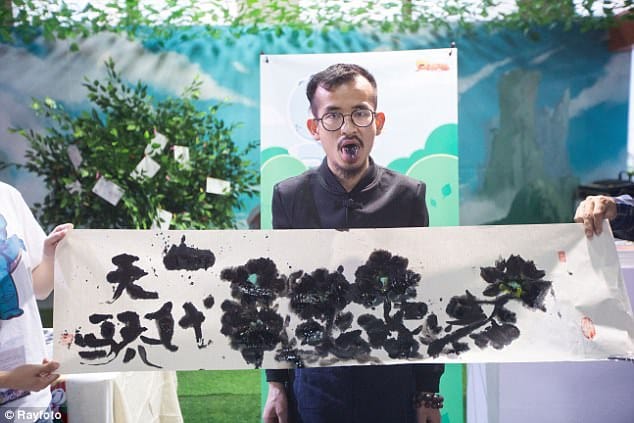Chinese artist creates ink paintings using TONGUE