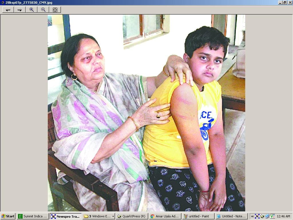 teacher beats student with stick