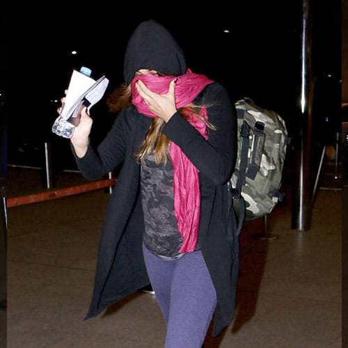 Nargis Fakhri & Uday Chopra Spotted At Mumbai Airport Where Nargis Hides Her Face