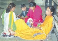 document verification, lady teacher, with baby