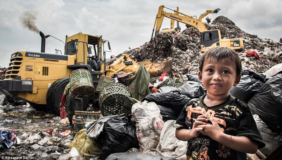 images reveal life inside a giant rubbish dump that’s home to 3,000 families  