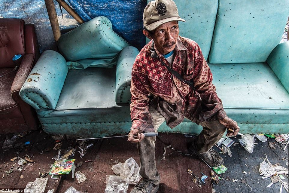 images reveal life inside a giant rubbish dump that’s home to 3,000 families  