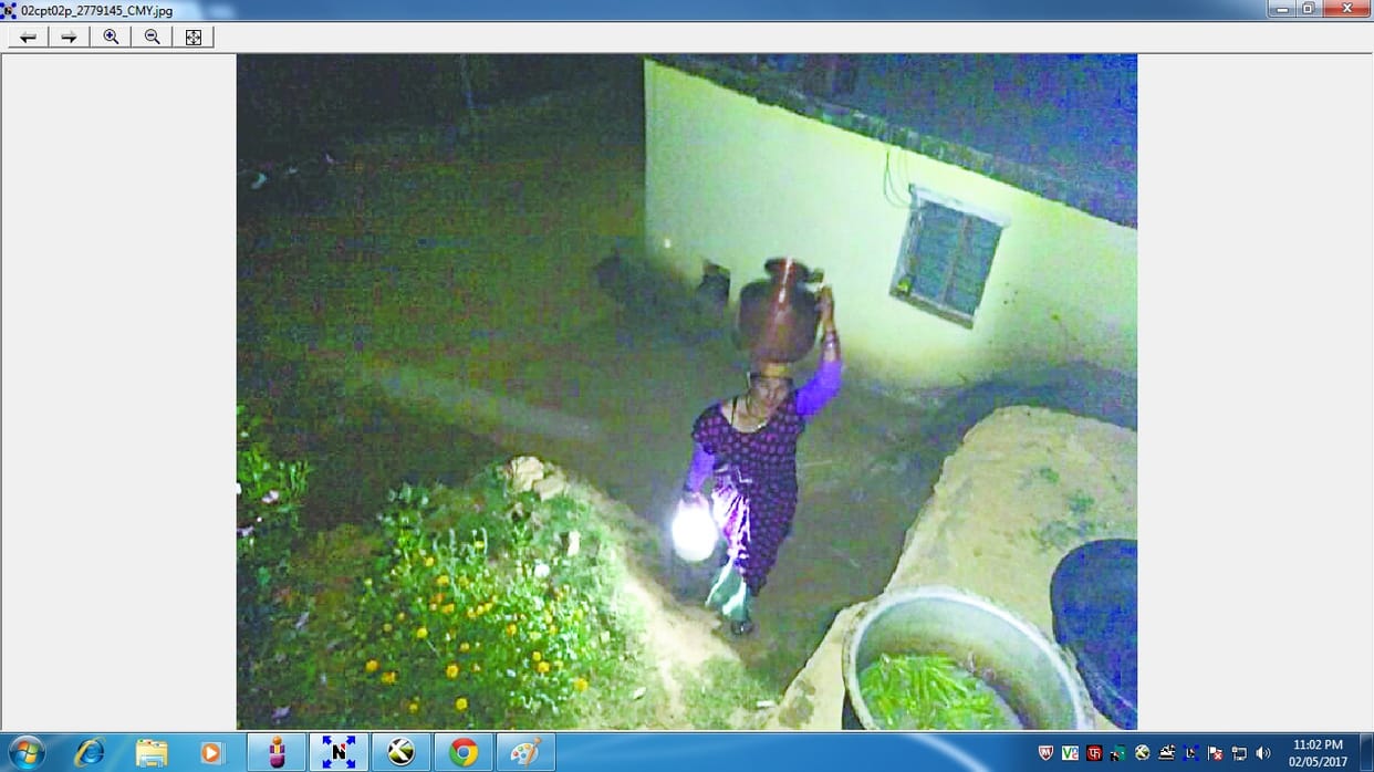 women fetching water in lamp 