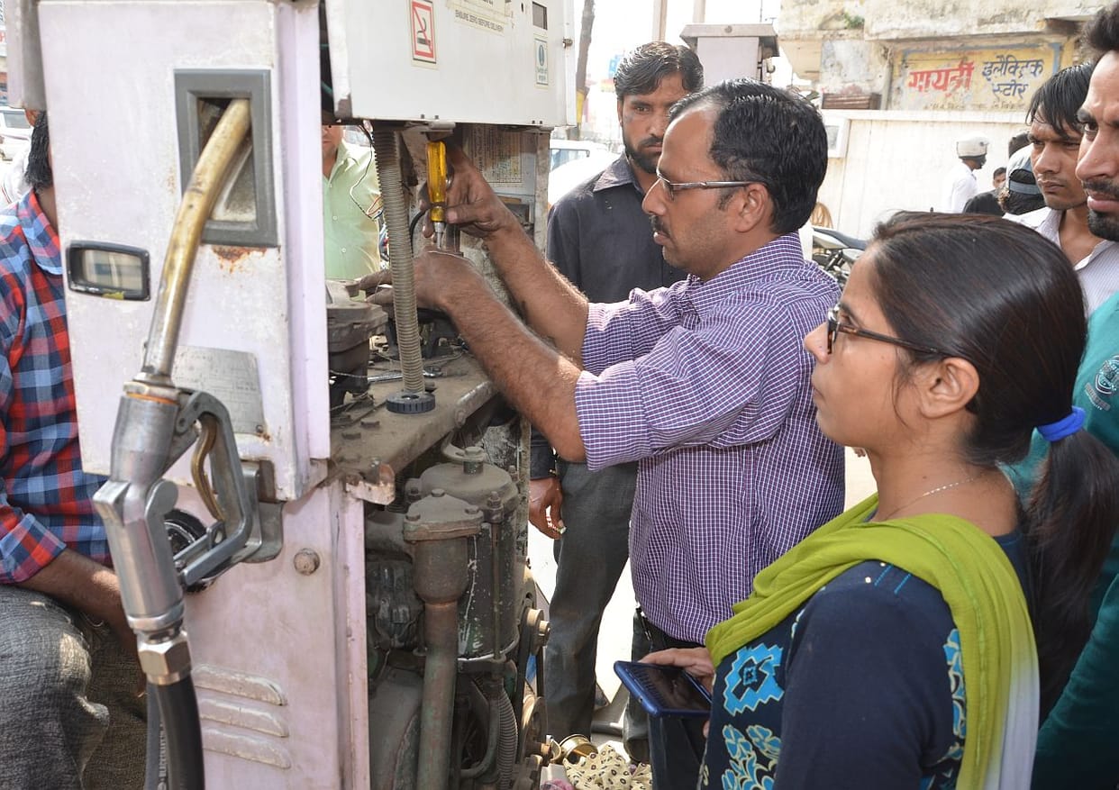Police-administration raid on petrol pump.