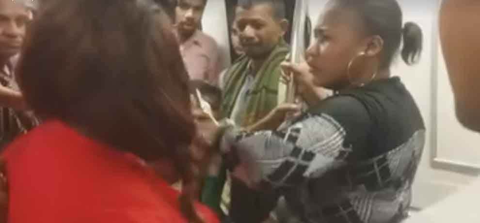 african woman removes her cloth in delhi metro, video goes viral