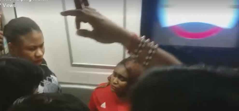 african woman removes her cloth in delhi metro, video goes viral