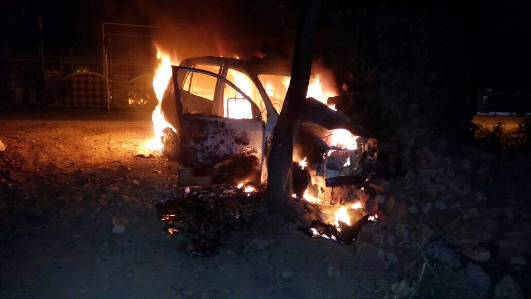 police rescue two people from burning car