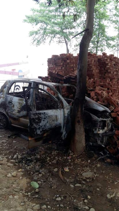 police rescue two people from burning car