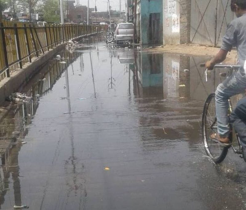People with irrigation water on service road are disturbed