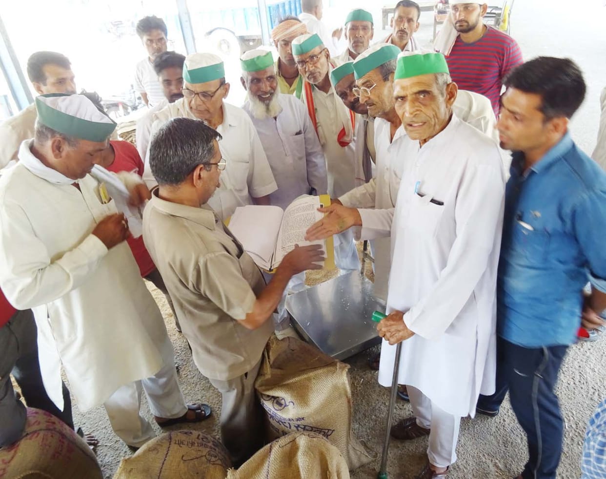 Farmers encircle the center in charge