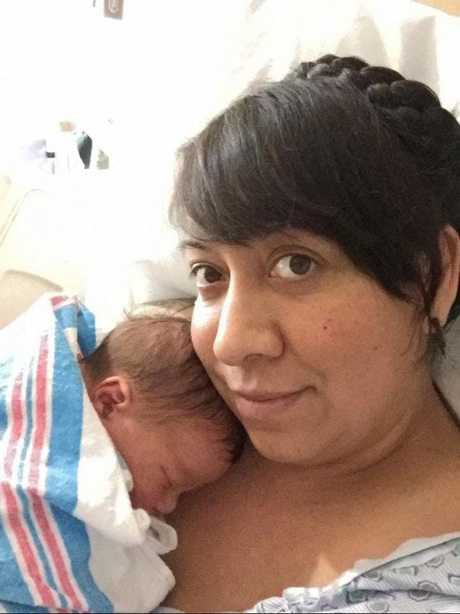 new born baby holding contraceptive in his hand during parturition