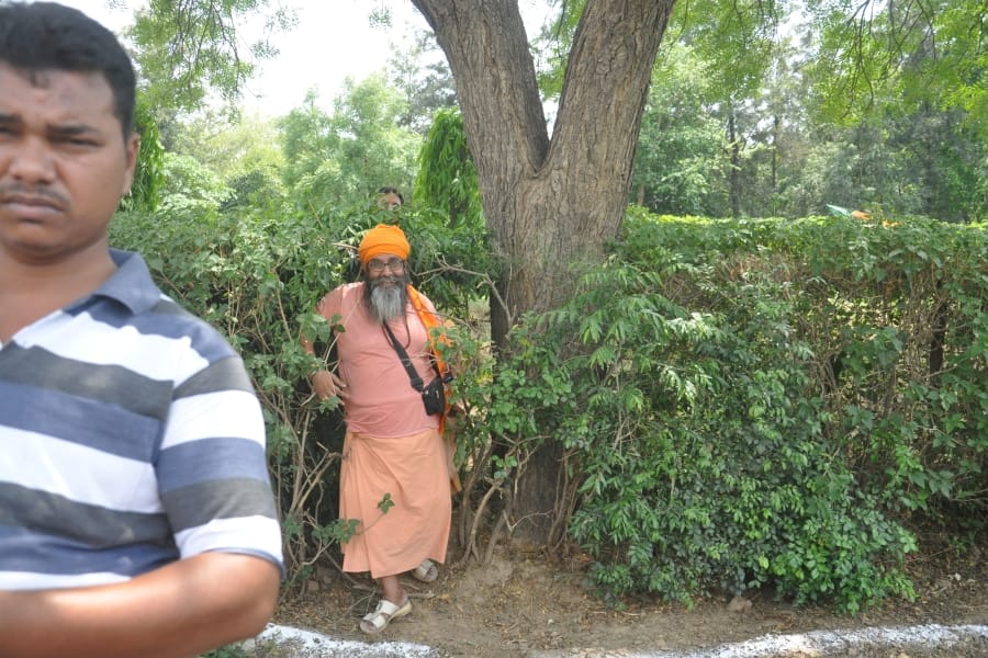who was these person behind cm yogi in agra