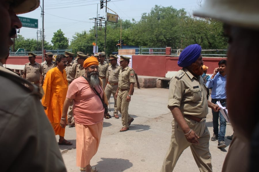 who was these person behind cm yogi in agra