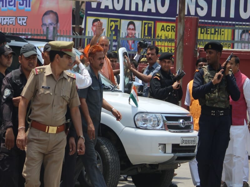 who was these person behind cm yogi in agra