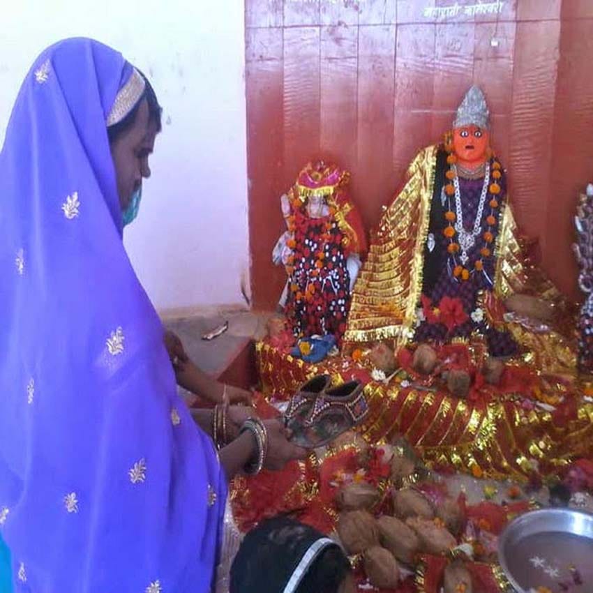 devotees offer footwear to goddess