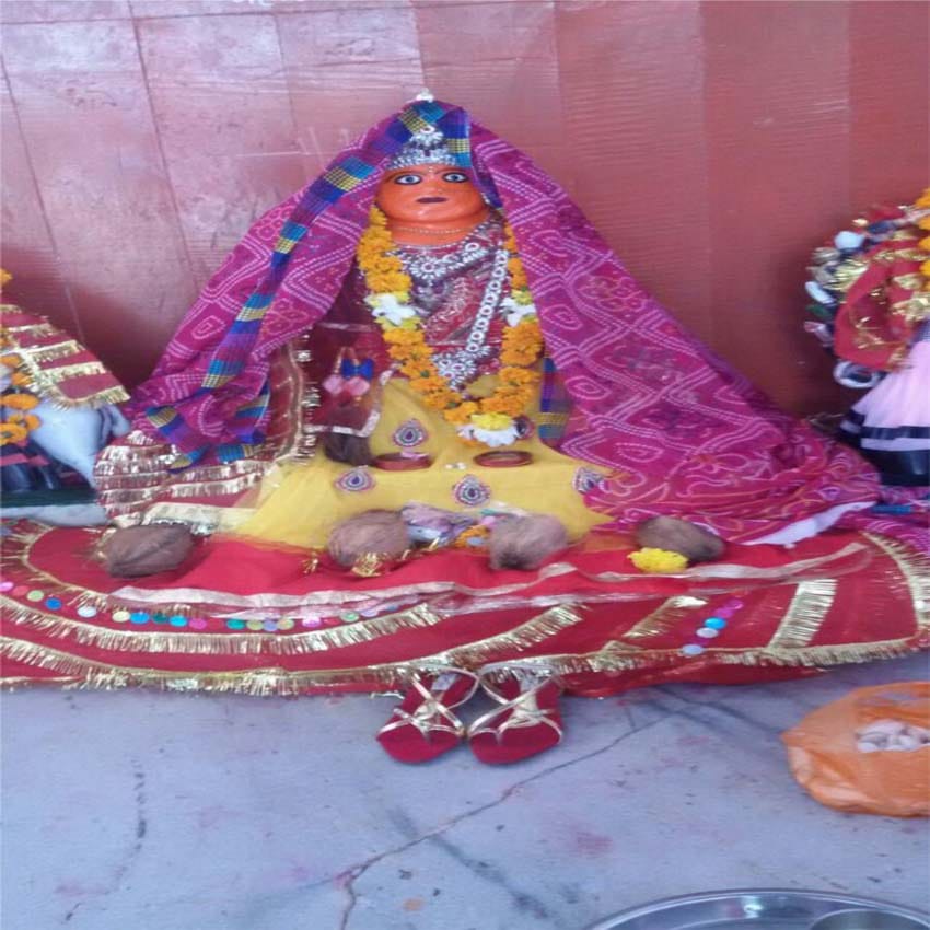 devotees offer footwear to goddess