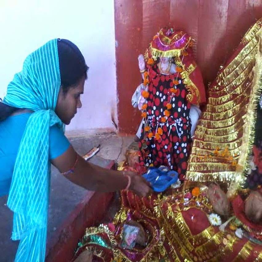 devotees offer footwear to goddess