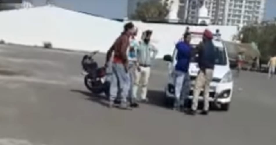 video of policemen being thrashed on road by boys goes viral