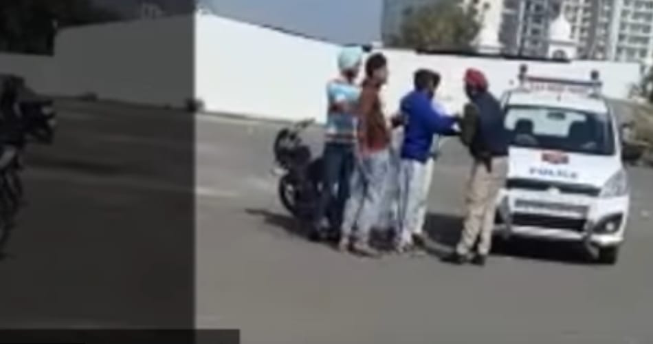 video of policemen being thrashed on road by boys goes viral
