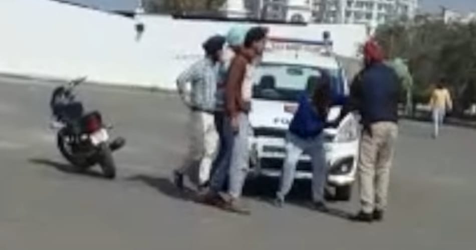 video of policemen being thrashed on road by boys goes viral