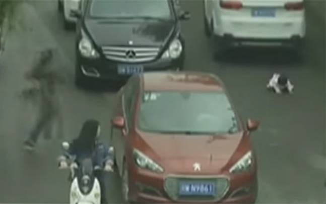 Two of the cars that passed over the little girl, the miraculously survived baby girl
