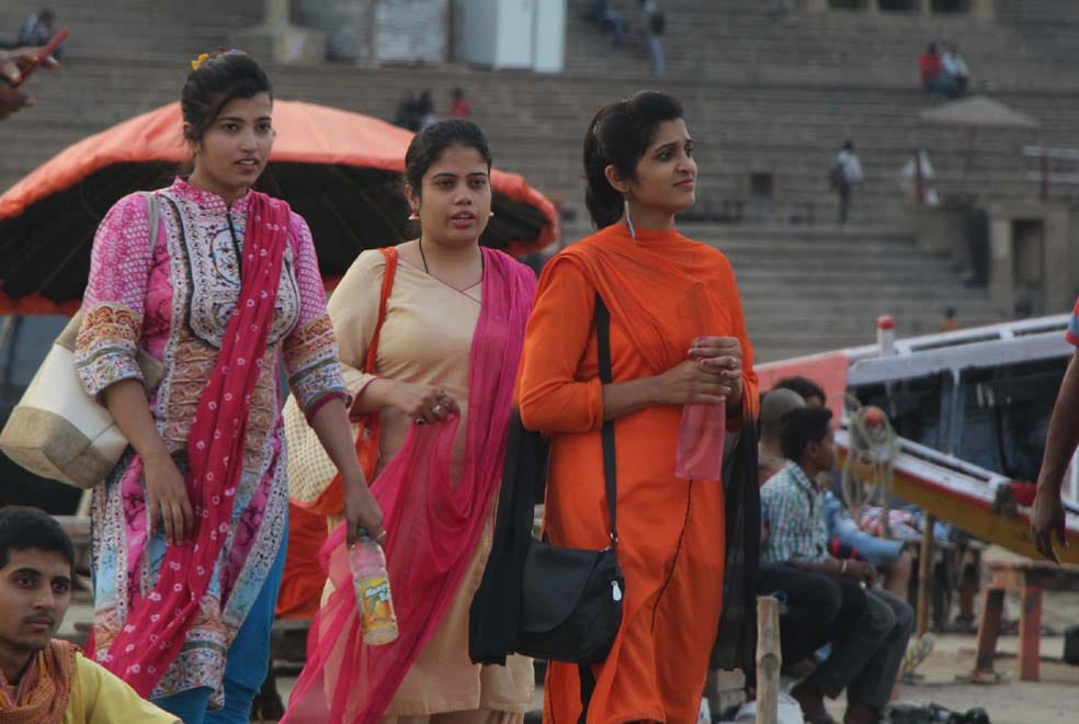 people arrived varanasi ghat for vist and tour after weather changed