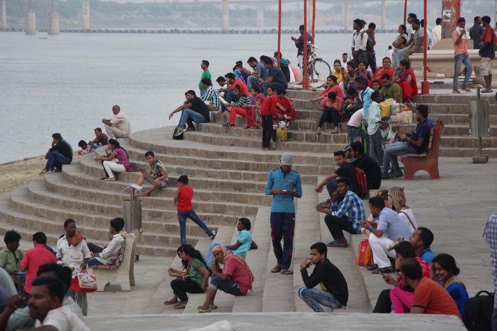 people arrived varanasi ghat for vist and tour after weather changed