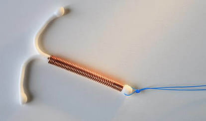 truth behind the viral photo of baby with holding contraceptive device 
