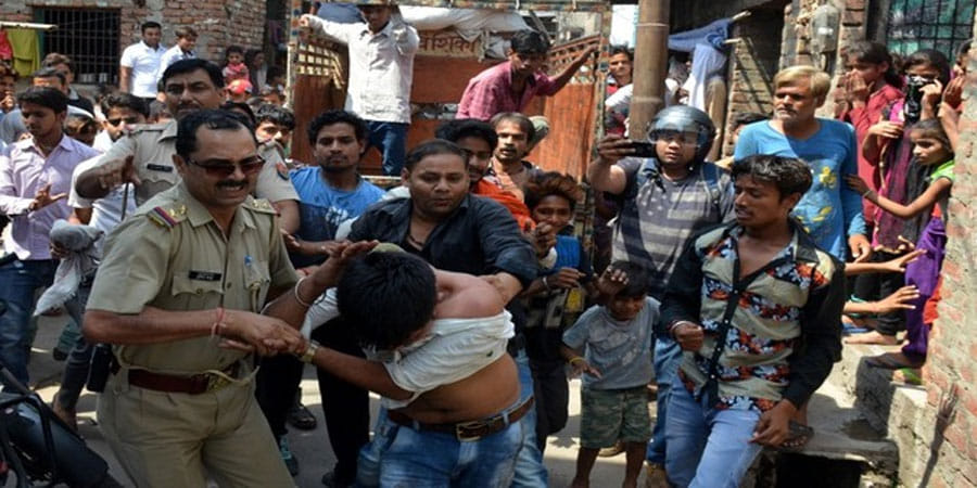 angry crowd beats men over buffalo slaughtering in dairy 