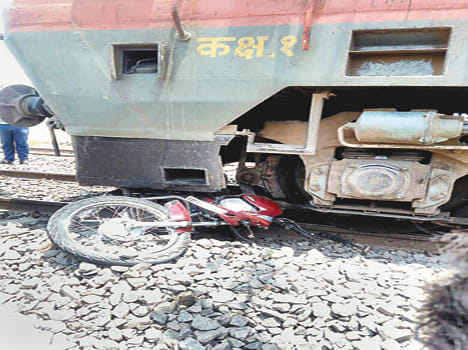 Bike in the grip of train engine