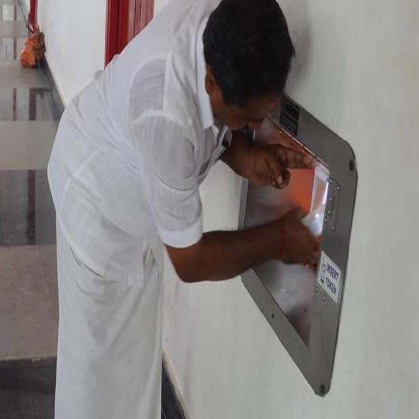 devotees get burger and cake with mineral water as prasadam