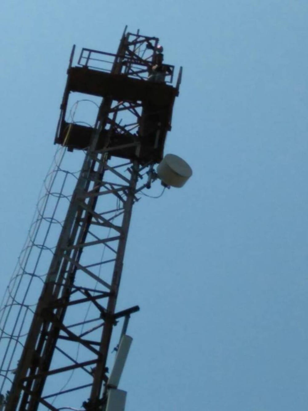 a student climb in tower in dehradun for his demand