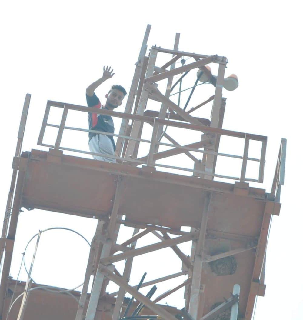 photos of Dav student on mobile tower