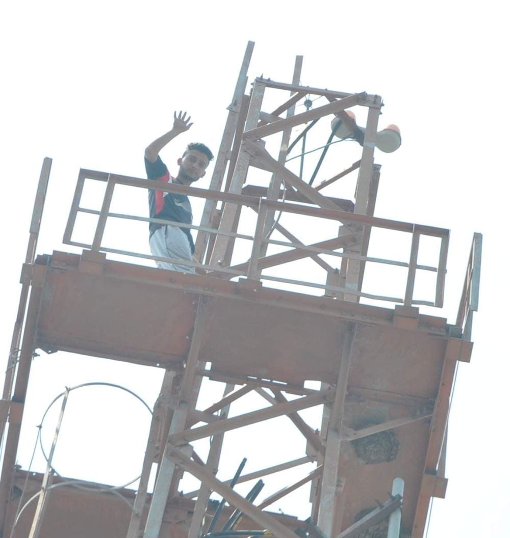 photos of Dav student on mobile tower