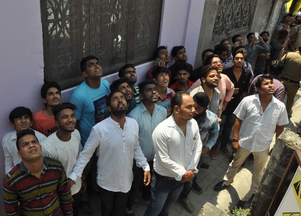 photos of Dav student on mobile tower