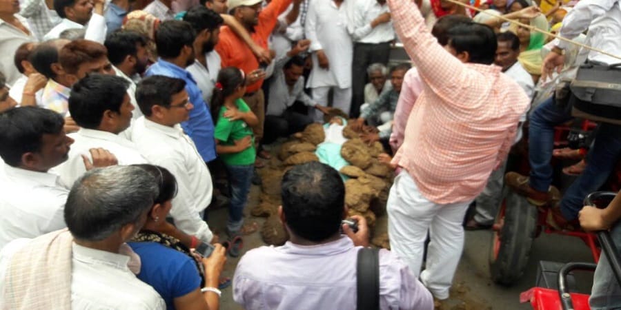 Mada women farmer lying on pi in MDA office, the warning