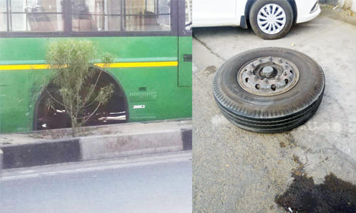 A moving bus tire and collided with two cars