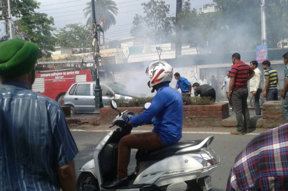car in fire in darshan lal chowk dehradun