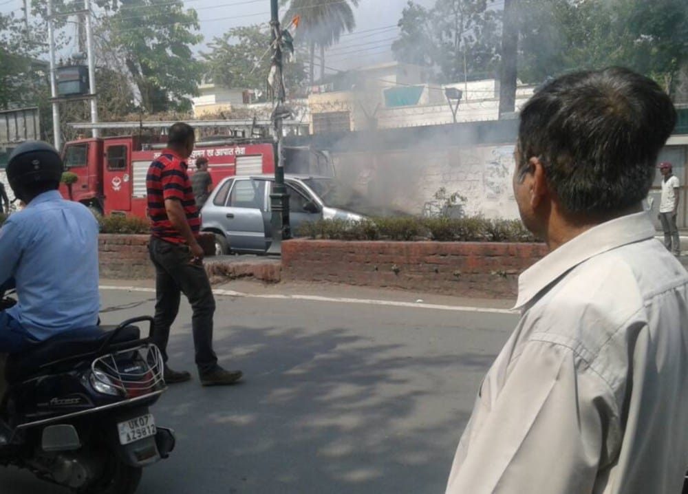 car in fire in darshan lal chowk dehradun