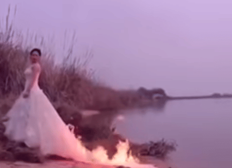 bride sets her gown on fire for perfect selfie 