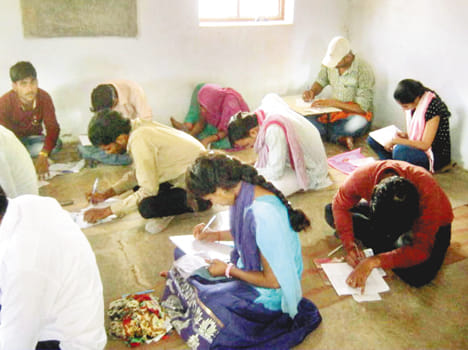 Student sitting on the ground exam