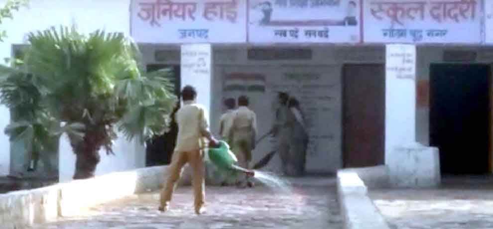 School in greater noida student has to clean utensil after having mid day meal