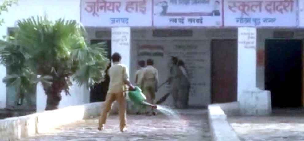 School in greater noida student has to clean utensil after having mid day meal