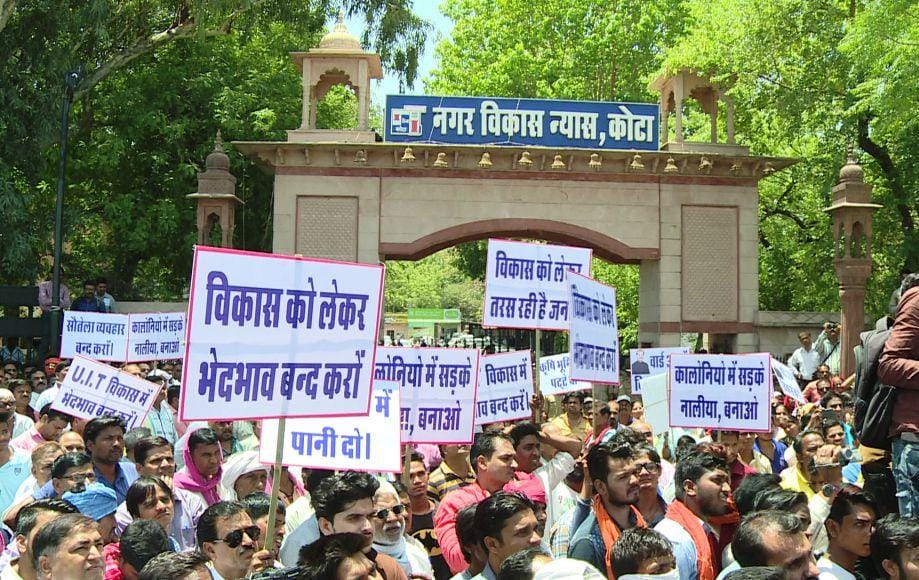 group of people protest outside kota uit in the leadership of bjp Councilor